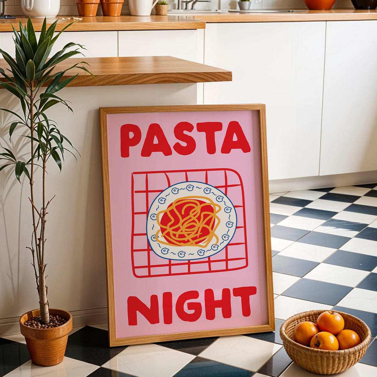 Pasta night pink print in an oak frame by a kitchen island and checkered floor