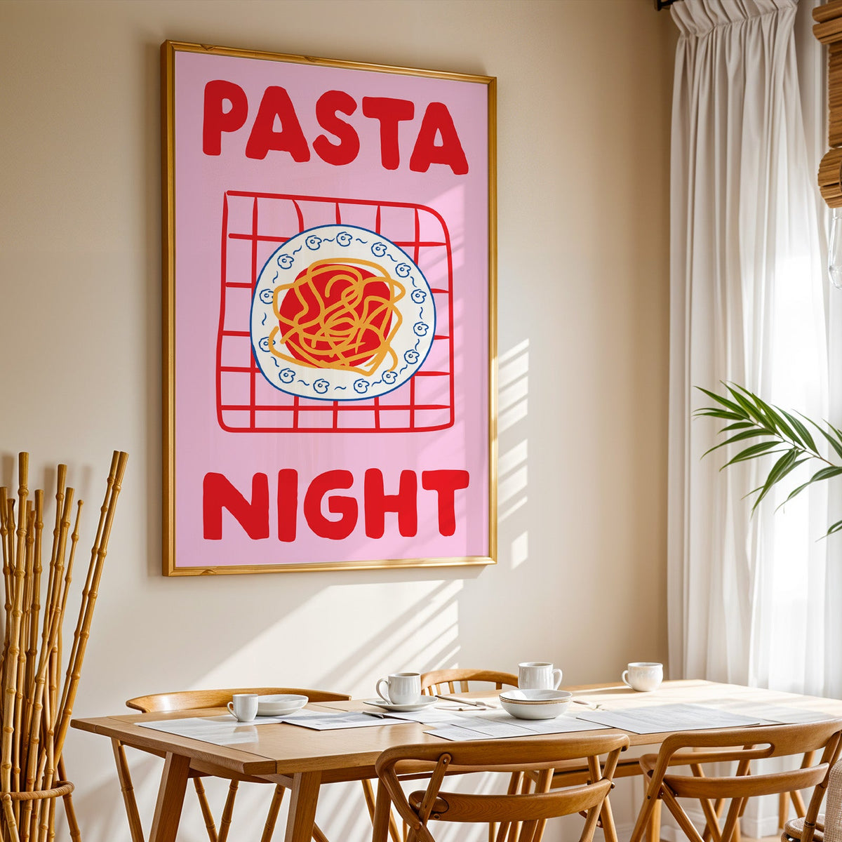 Pasta night pink print in a gold frame above a sunlit breakfast table