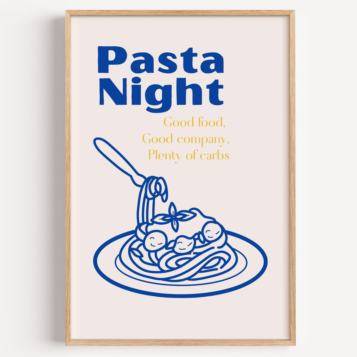 Pasta Night cobalt spaghetti and meatballs print in a light oak frame on a plain white wall