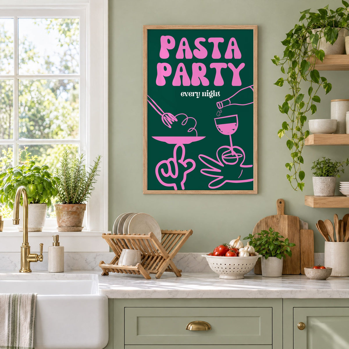 Pasta Party every night green print in an oak frame on a sage green kitchen wall beside a farmhouse sink and herbs