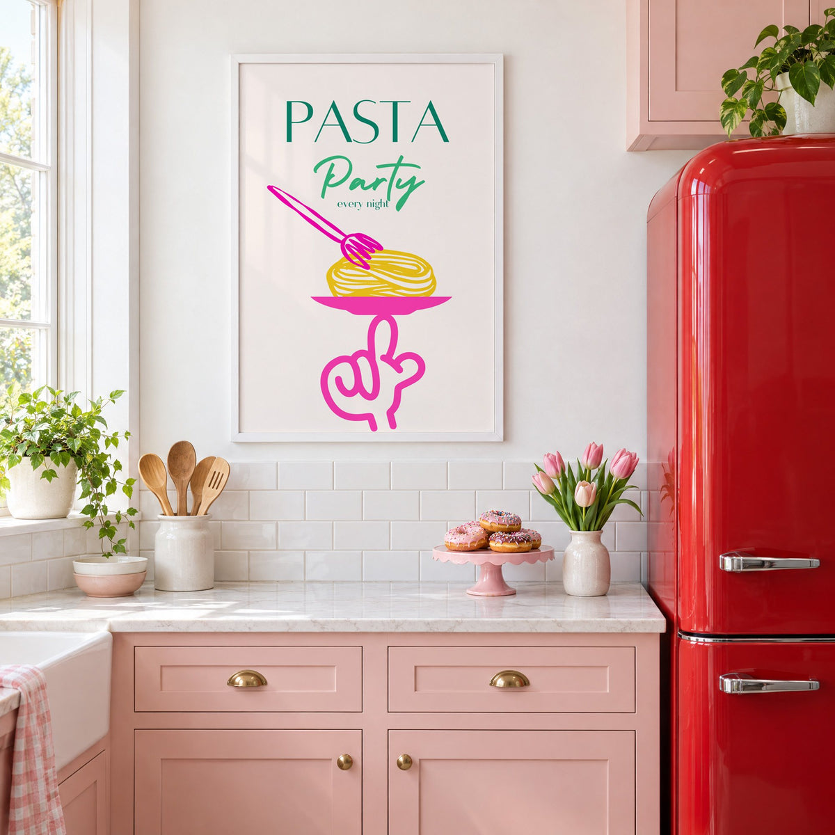 PASTA Party every night spaghetti plate print in a white frame above pink cabinets beside a red retro fridge