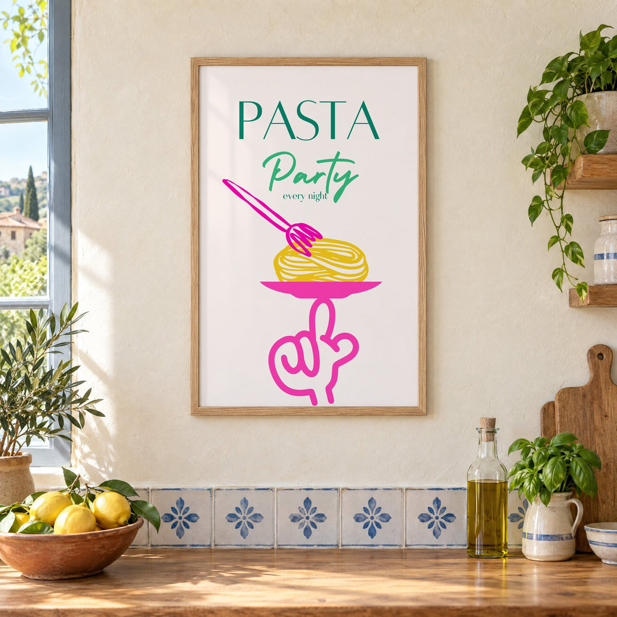 PASTA Party every night spaghetti plate print in an oak frame on a cream plaster wall above a worktop with a bowl of lemons and blue-and-white tiles