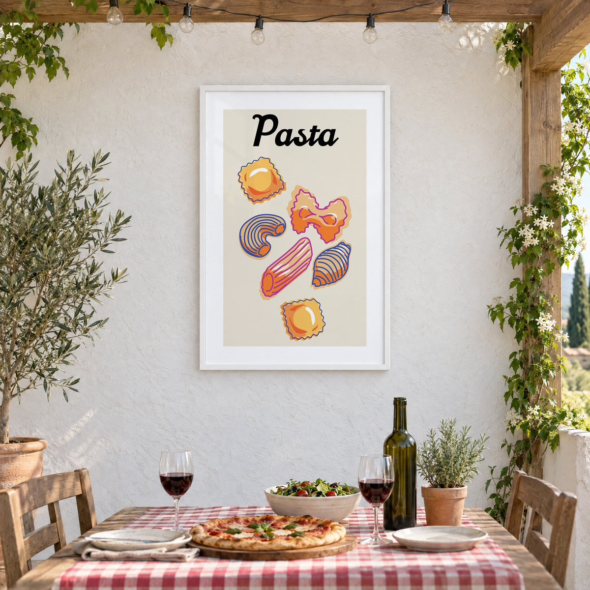 Pasta six pasta shapes offset-outline print in a white frame on a stucco wall above a checked-cloth table with pizza and red wine