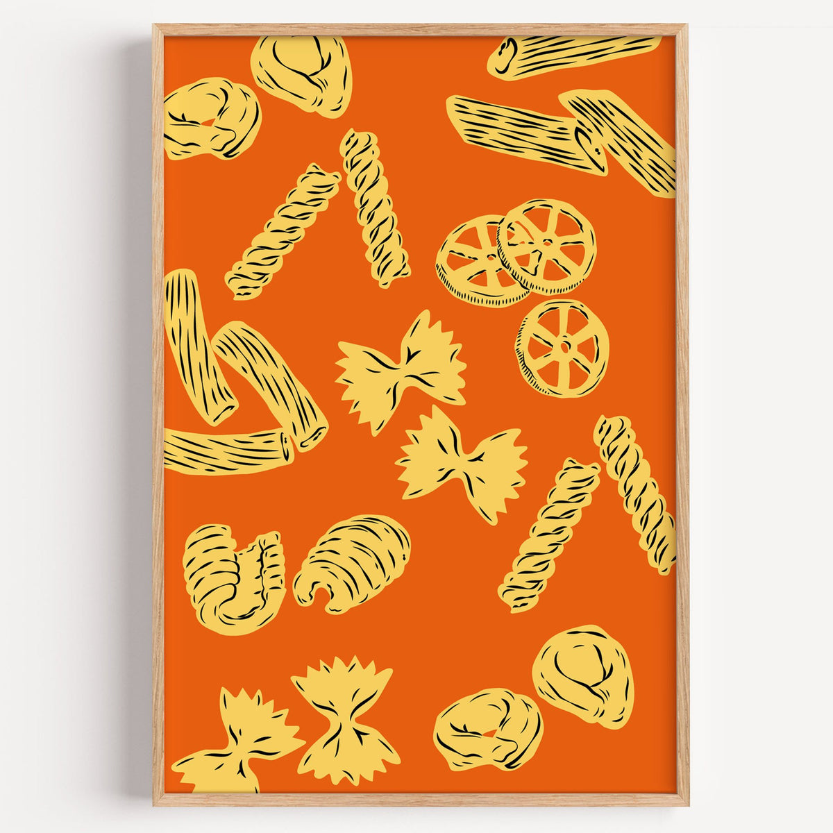 Orange pasta pattern woodcut-style print in a light oak frame on a plain white wall