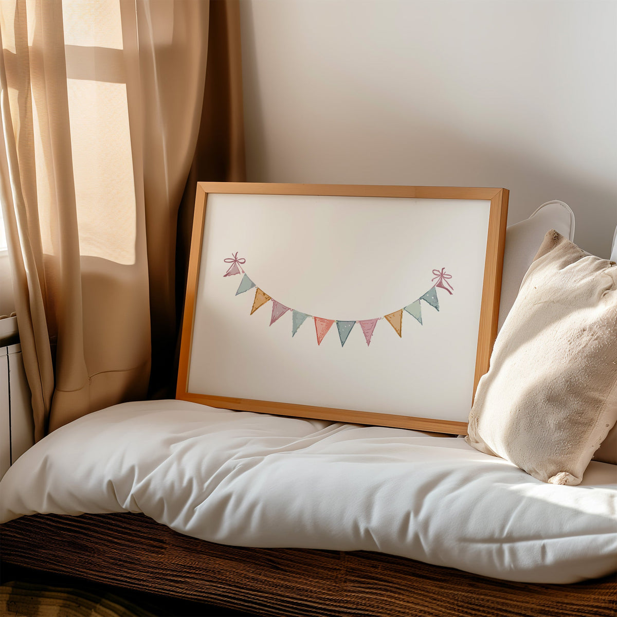 Pastel triangle bunting garland with bows nursery print in a honey wood frame on a cushioned window seat by sheer curtains