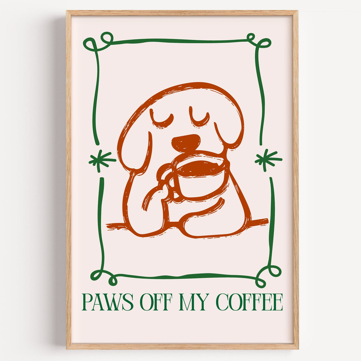 PAWS OFF MY COFFEE dog and mug print in a light oak frame on a plain white wall