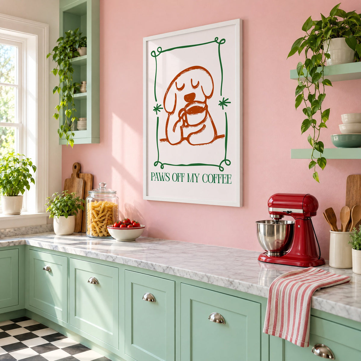 PAWS OFF MY COFFEE dog and mug print in a white frame on a pink wall above mint green cabinets in a retro kitchen, seen at an angle