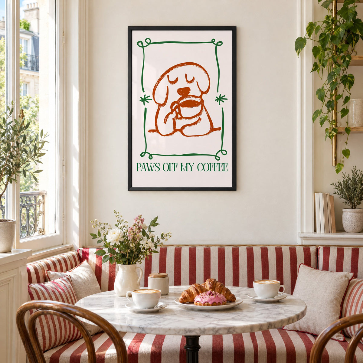 PAWS OFF MY COFFEE dog and mug print in a black frame above a striped cafe breakfast nook with cappuccino and pastries