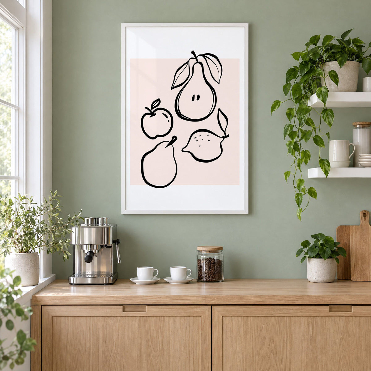 Pear apple lemon black line art print in a white frame on a sage green coffee nook wall above an espresso machine