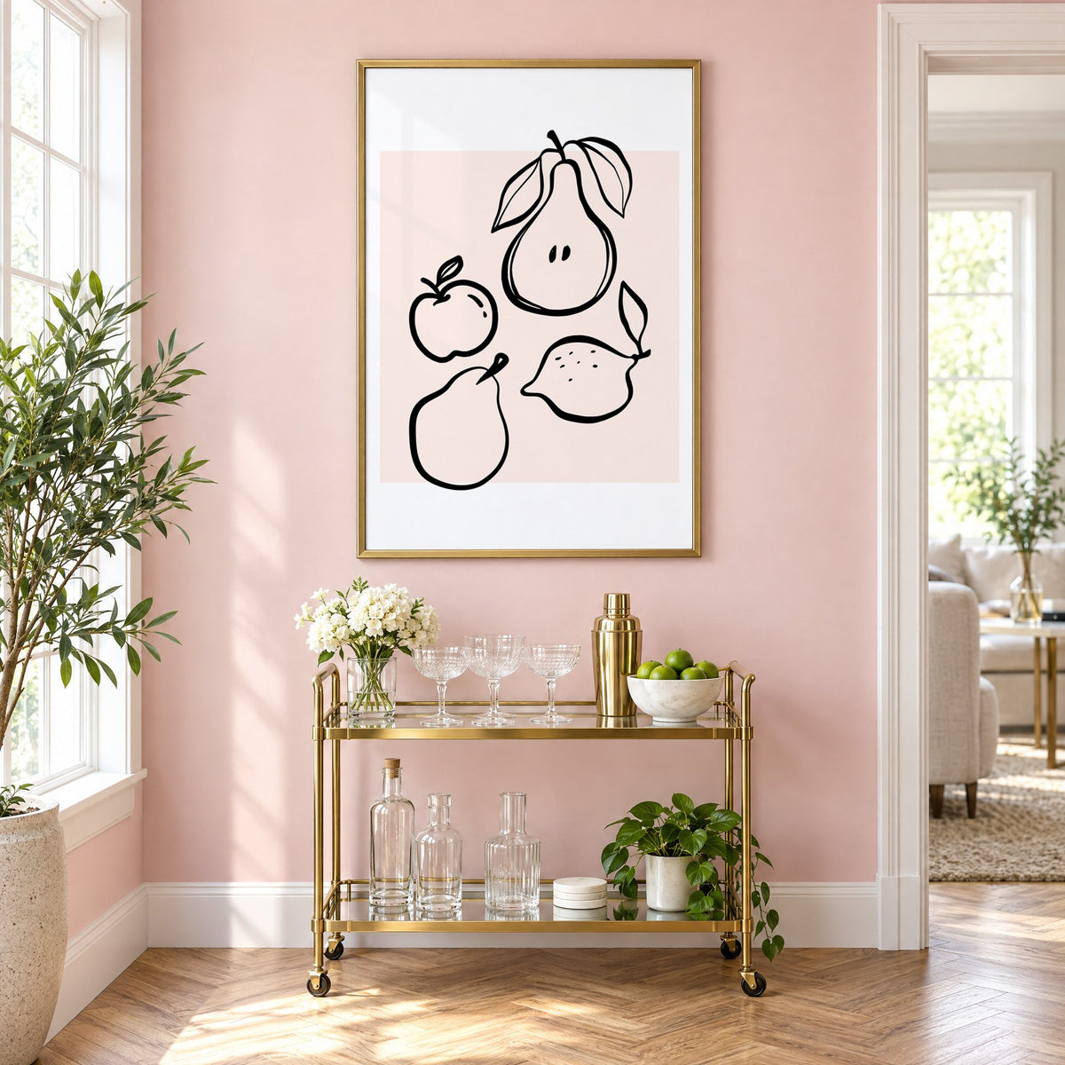Pear apple lemon black line art print in a brass frame above a gold bar cart on a blush pink wall