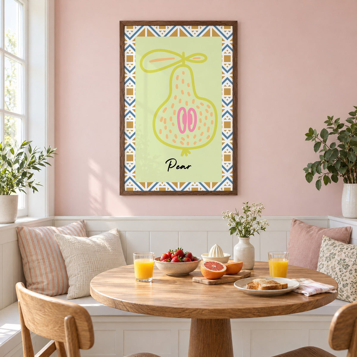 Pear lime line-art zigzag border print in a walnut frame on a pastel pink wall above a breakfast nook with strawberries and orange juice