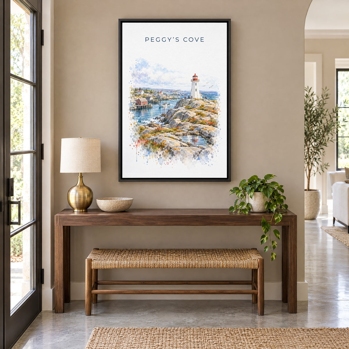 Peggy's Cove watercolor print as a black floater canvas above a walnut console and woven bench in an entryway