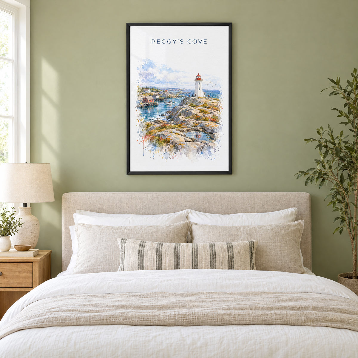 Peggy's Cove watercolor print in a black frame above an upholstered headboard in a sage green bedroom