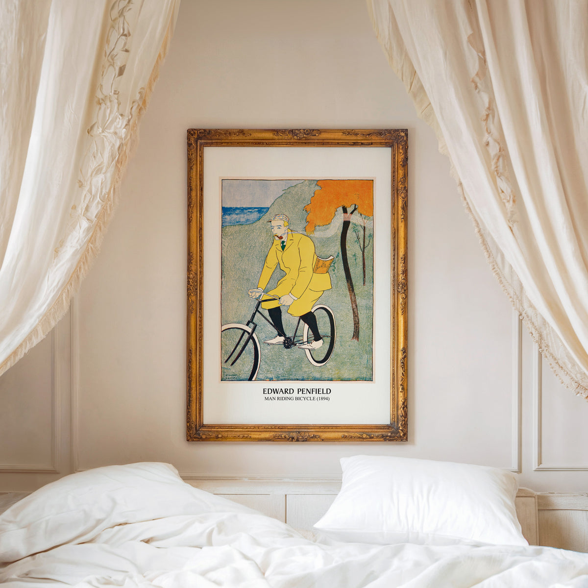 Man Riding Bicycle print shown in an ornate gold frame above a canopy bed