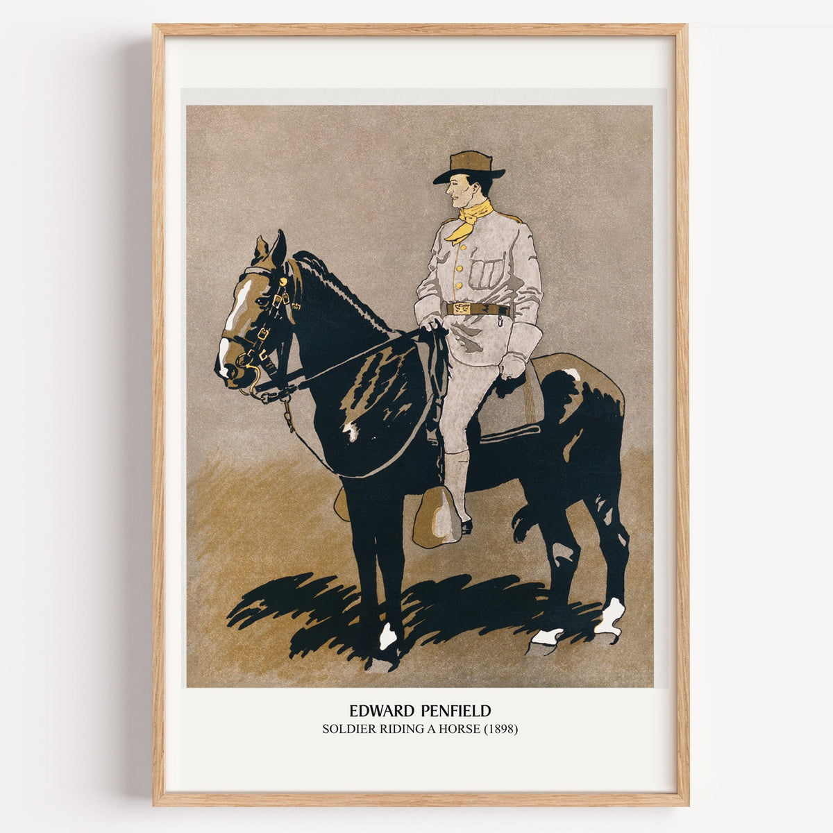 Edward Penfield Soldier Riding a Horse print in a light oak frame on a white wall
