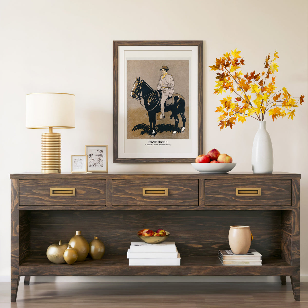Soldier Riding a Horse print in a walnut frame above a console with branches