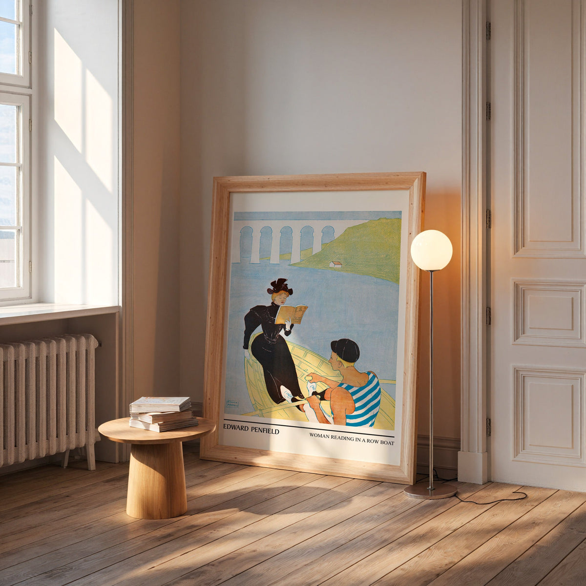 Vintage rowing poster in a wide pine frame leaning by a sunlit window