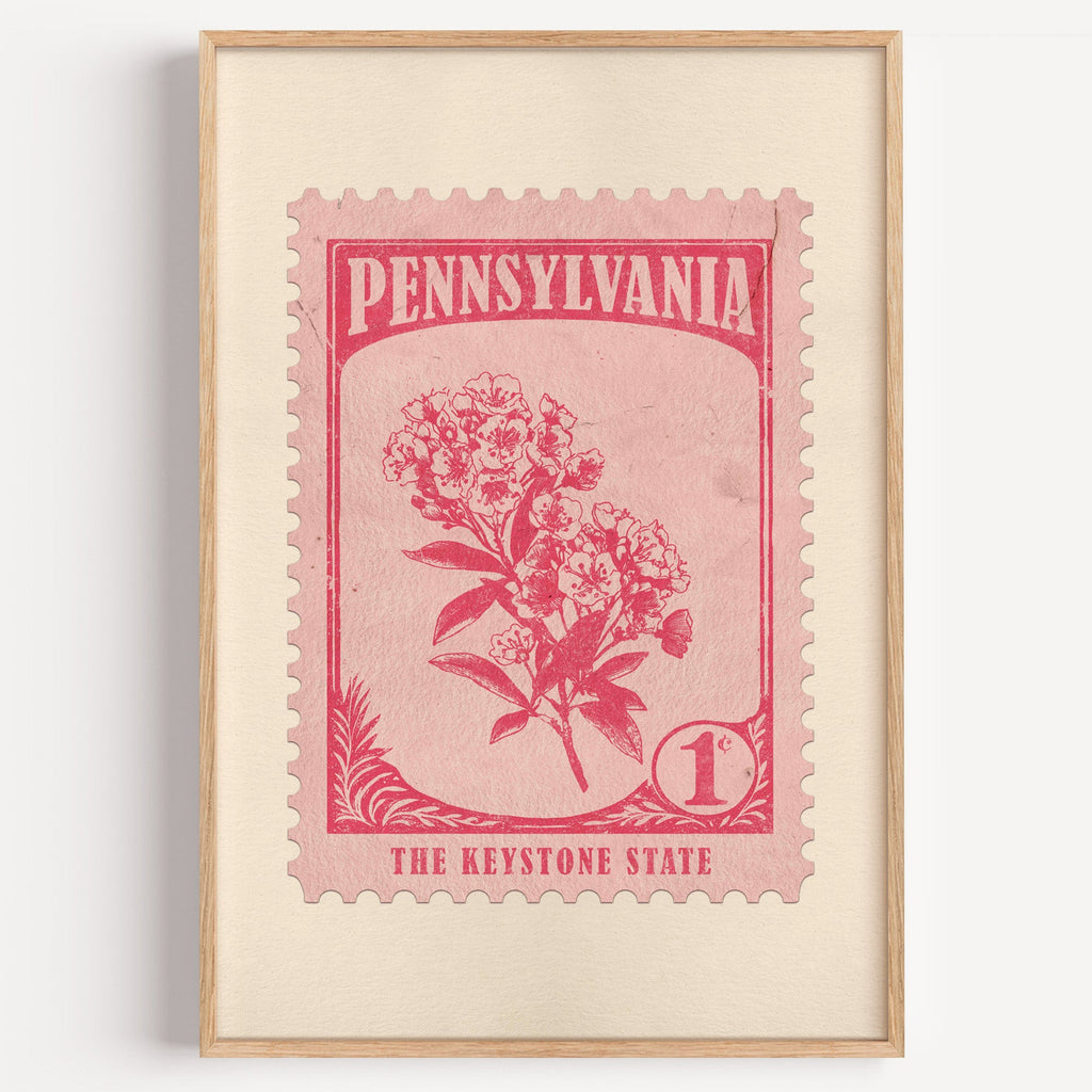Pennsylvania state flower stamp print in cerise on pink, light oak frame on a plain white wall