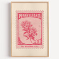 Pennsylvania state flower stamp print in cerise on pink, light oak frame on a plain white wall