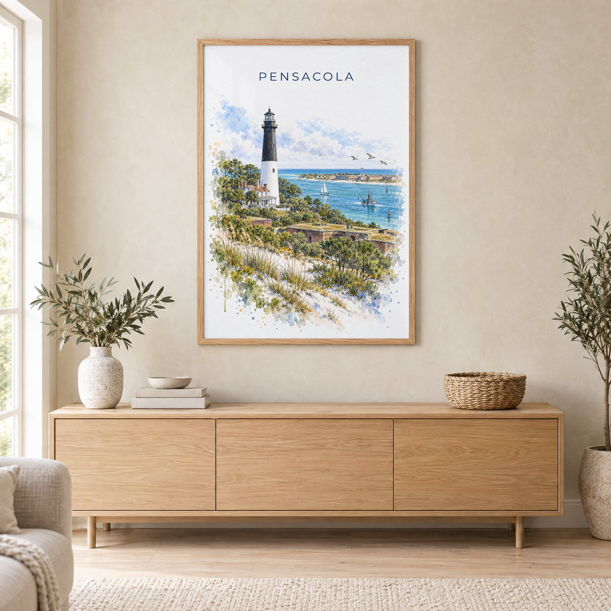 Pensacola watercolor print in an oak frame above a light wood sideboard in a Scandinavian living room