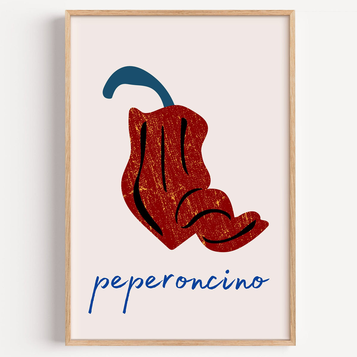 peperoncino red chili grunge print in a light oak frame on a plain white wall