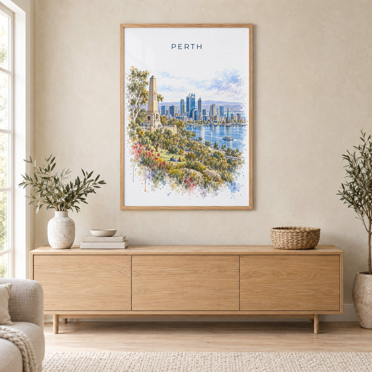 Perth, Australia watercolor print in an oak frame above a light wood sideboard in a Scandinavian living room