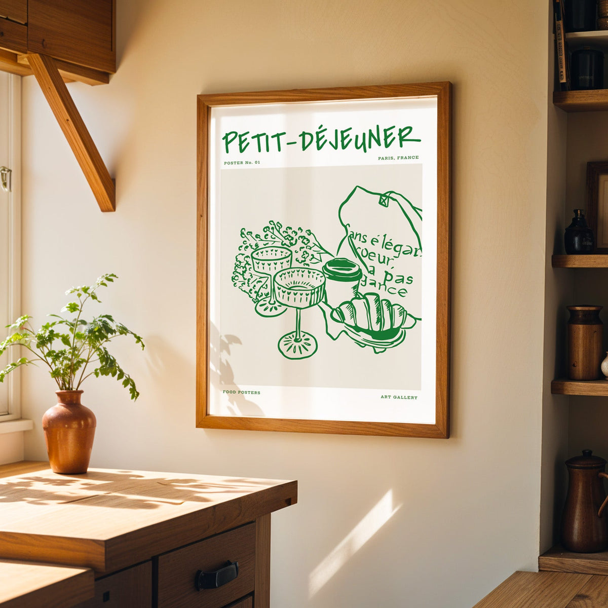 Petit Dejeuner green print in a walnut frame on a cream kitchen wall