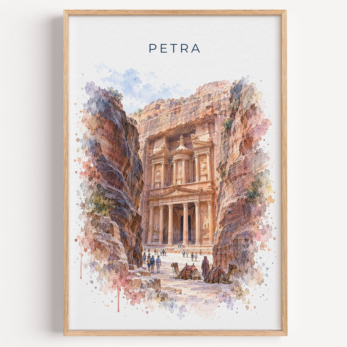 Petra watercolor print in a light oak frame on a plain white wall