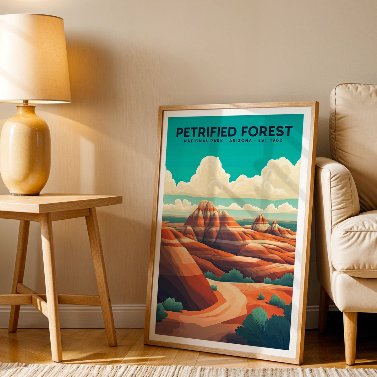 Petrified Forest print in an oak frame beside a cream armchair and an amber lamp in warm afternoon light
