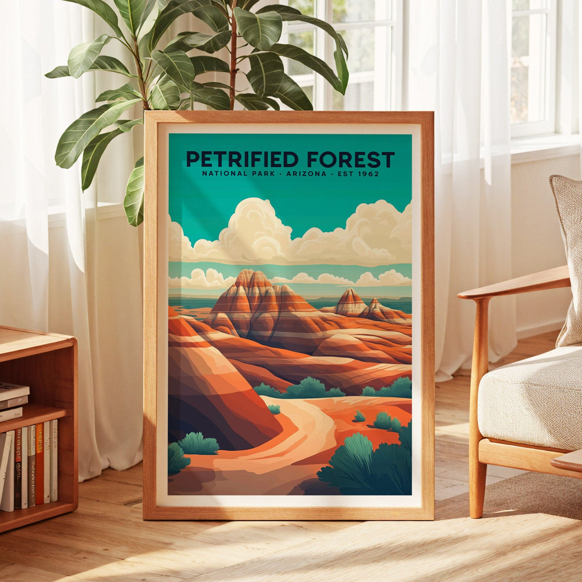 Petrified Forest National Park print in an oak frame by a sunlit window with sheer curtains and a fig plant