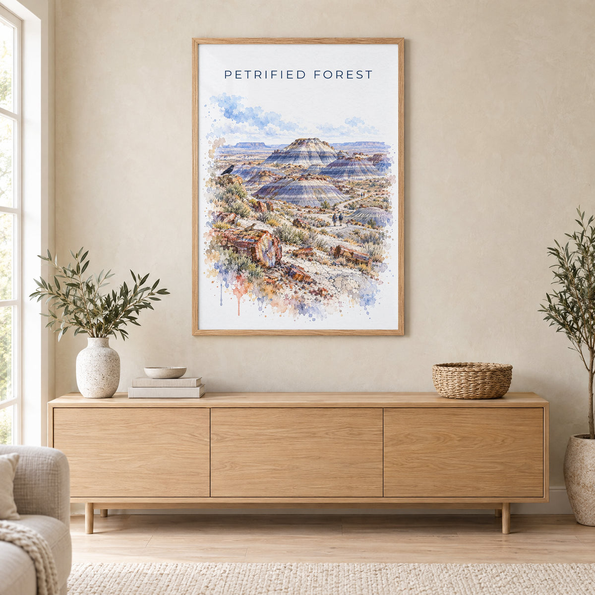 Petrified Forest National Park watercolor print in an oak frame above a light wood sideboard in a Scandinavian living room