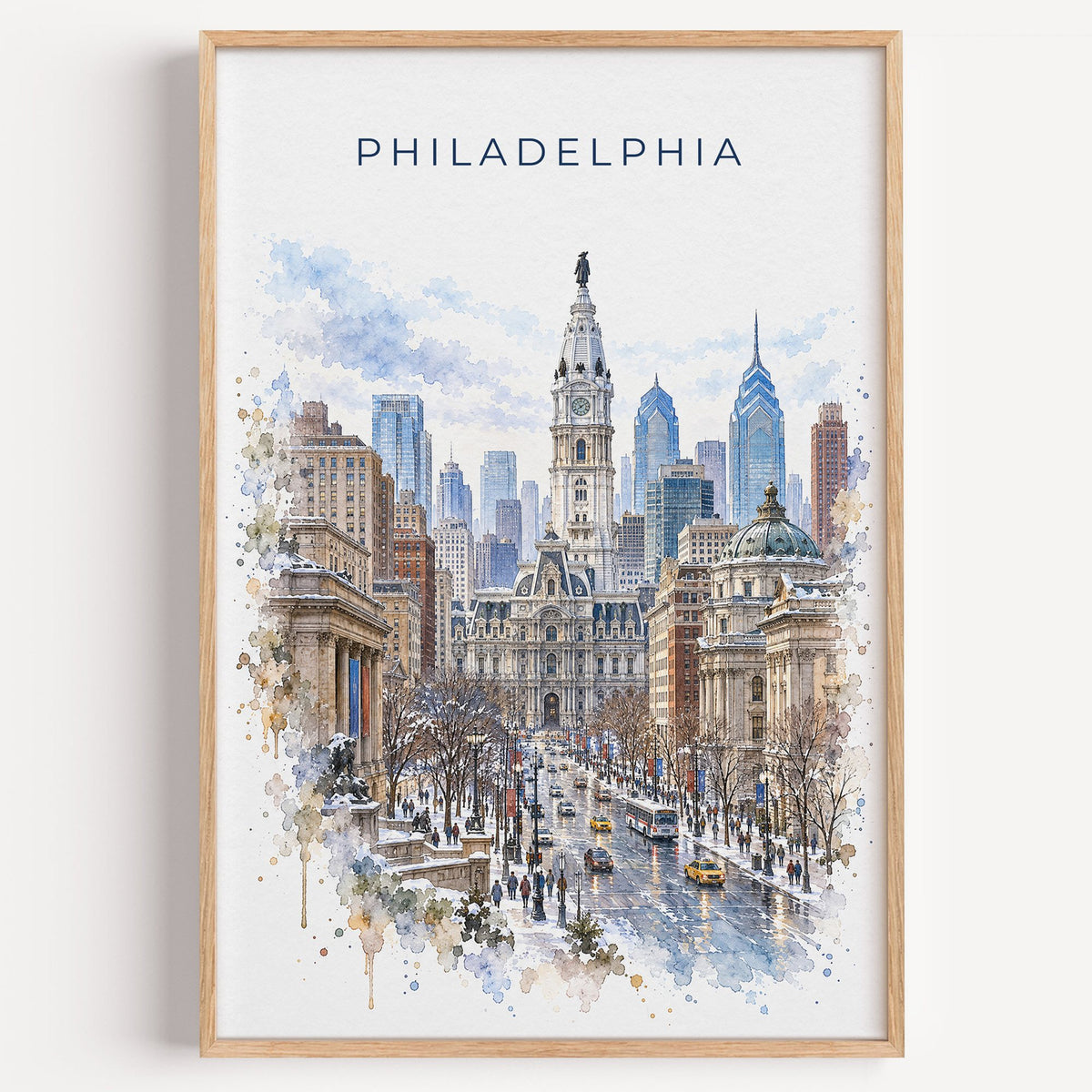 Philadelphia City Hall watercolor print in a light oak frame on a plain white wall