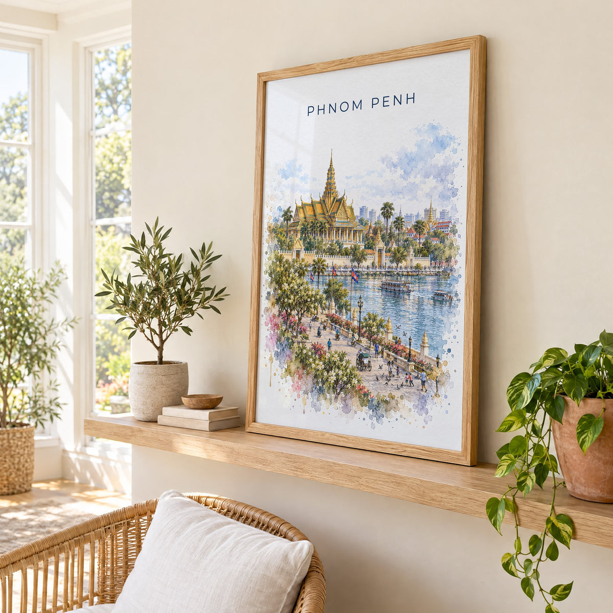 Phnom Penh watercolor print in an oak frame on a picture ledge in a sunlit sunroom