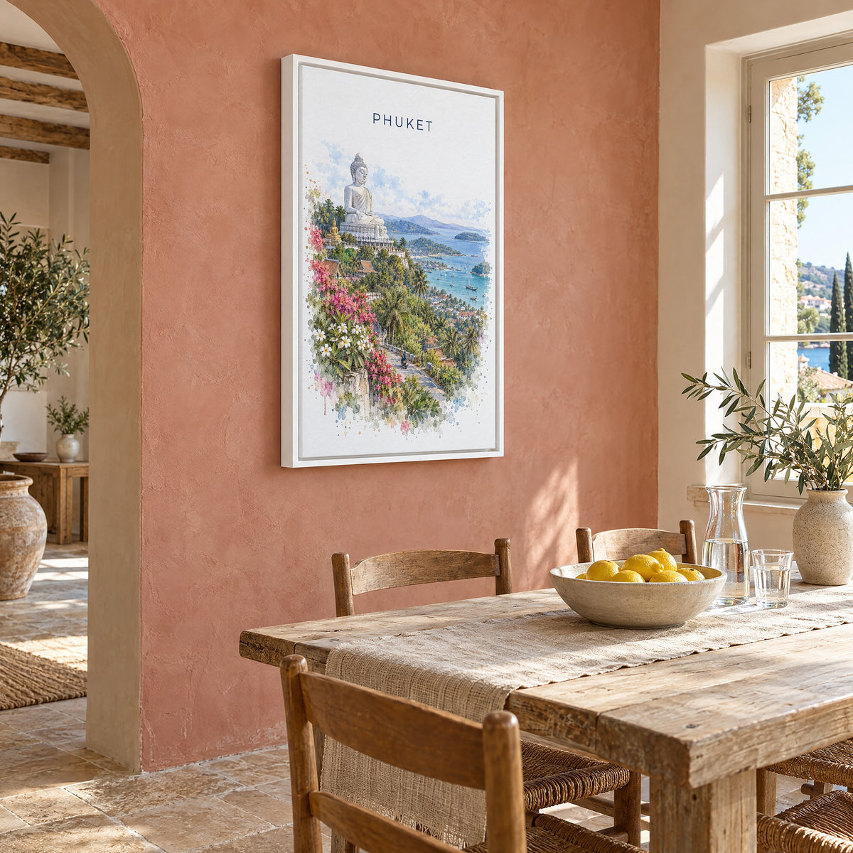 Phuket watercolor print as a white floater canvas on a terracotta wall above a rustic dining table