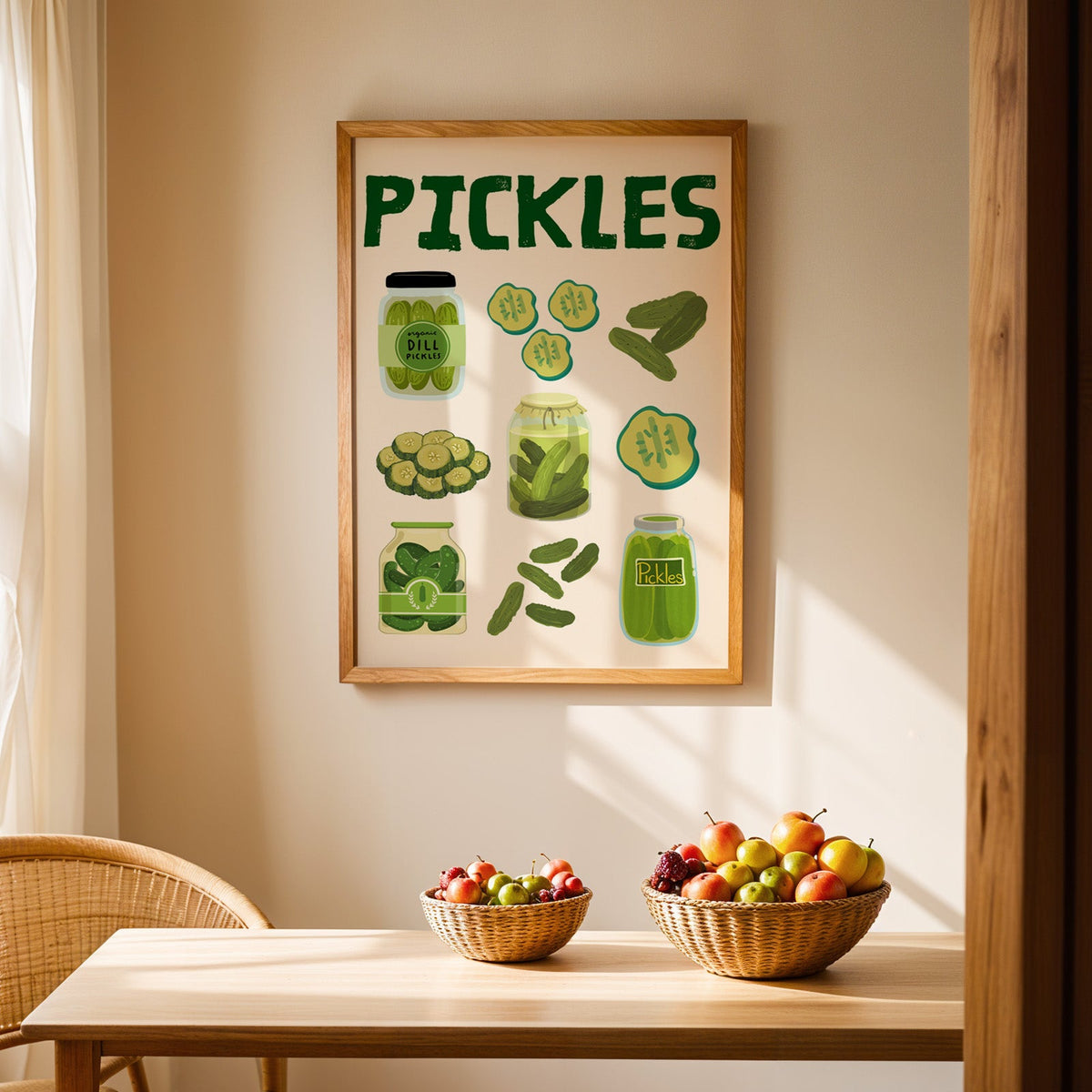Pickles jars and slices chart print in an oak frame above a light wood dining table with baskets of fruit