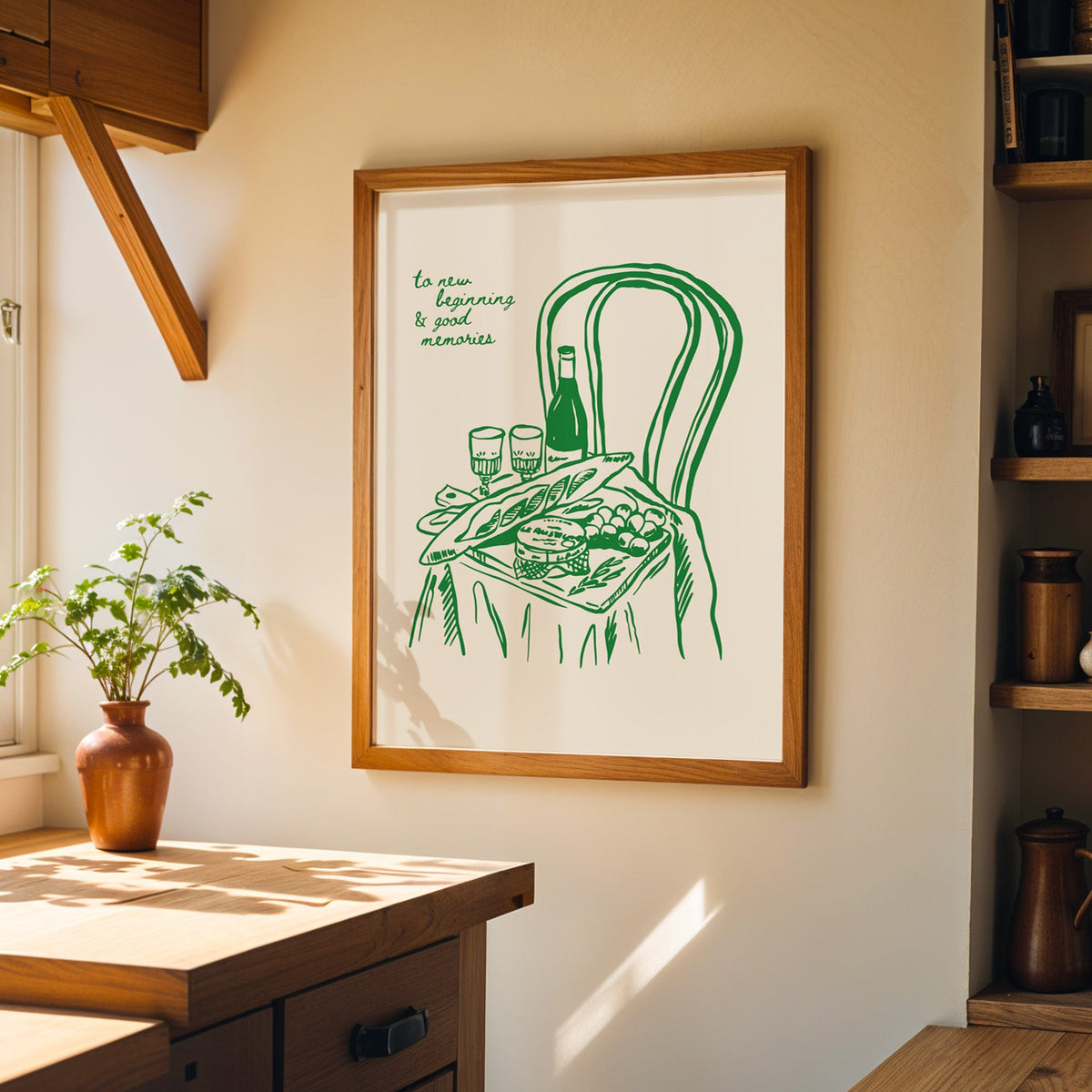 Picnic basket print in a walnut frame on a cream kitchen wall above the island