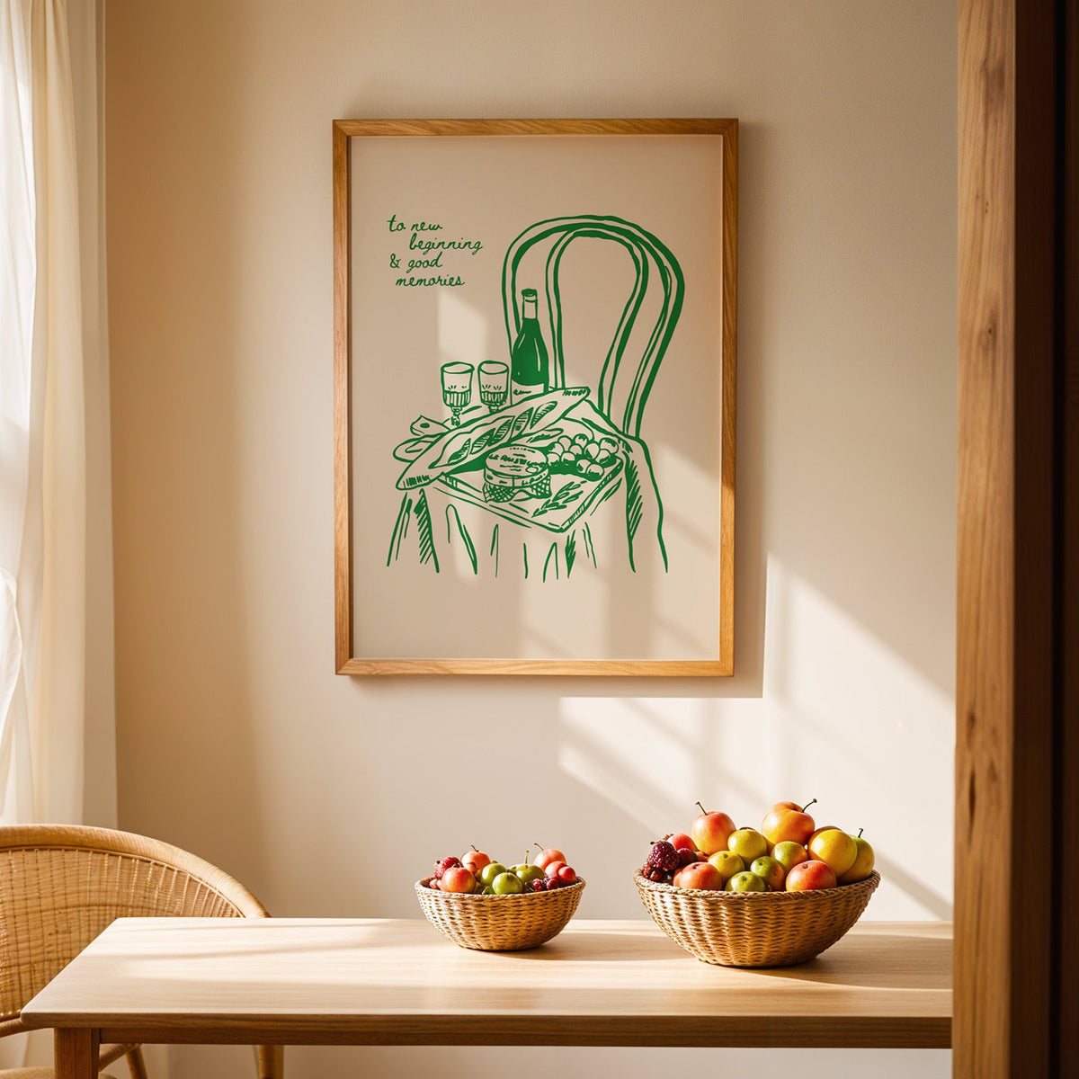 Picnic basket print in an oak frame hanging above a dining table with rattan chairs