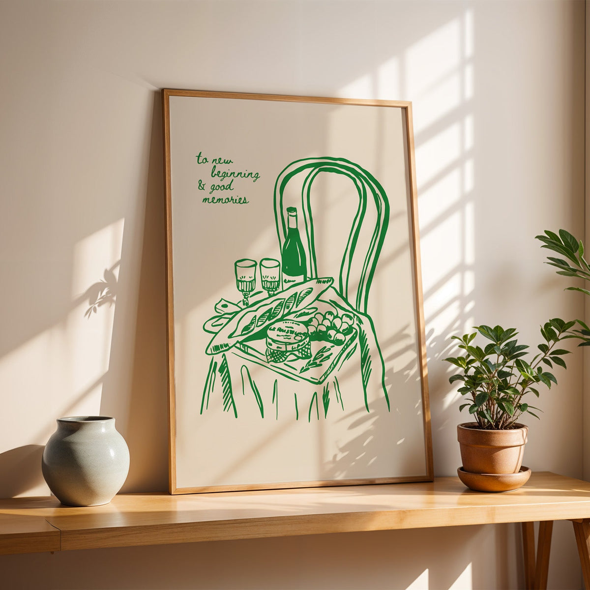 Picnic basket print in a slim oak frame on a console with a grey-blue vase