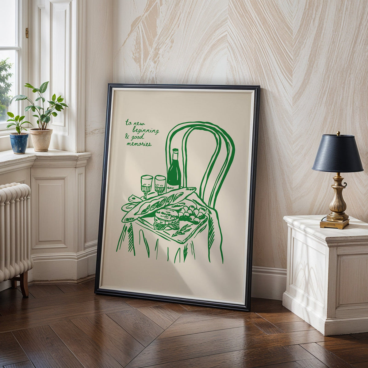 Picnic basket print in a black frame on a dark herringbone floor by a radiator