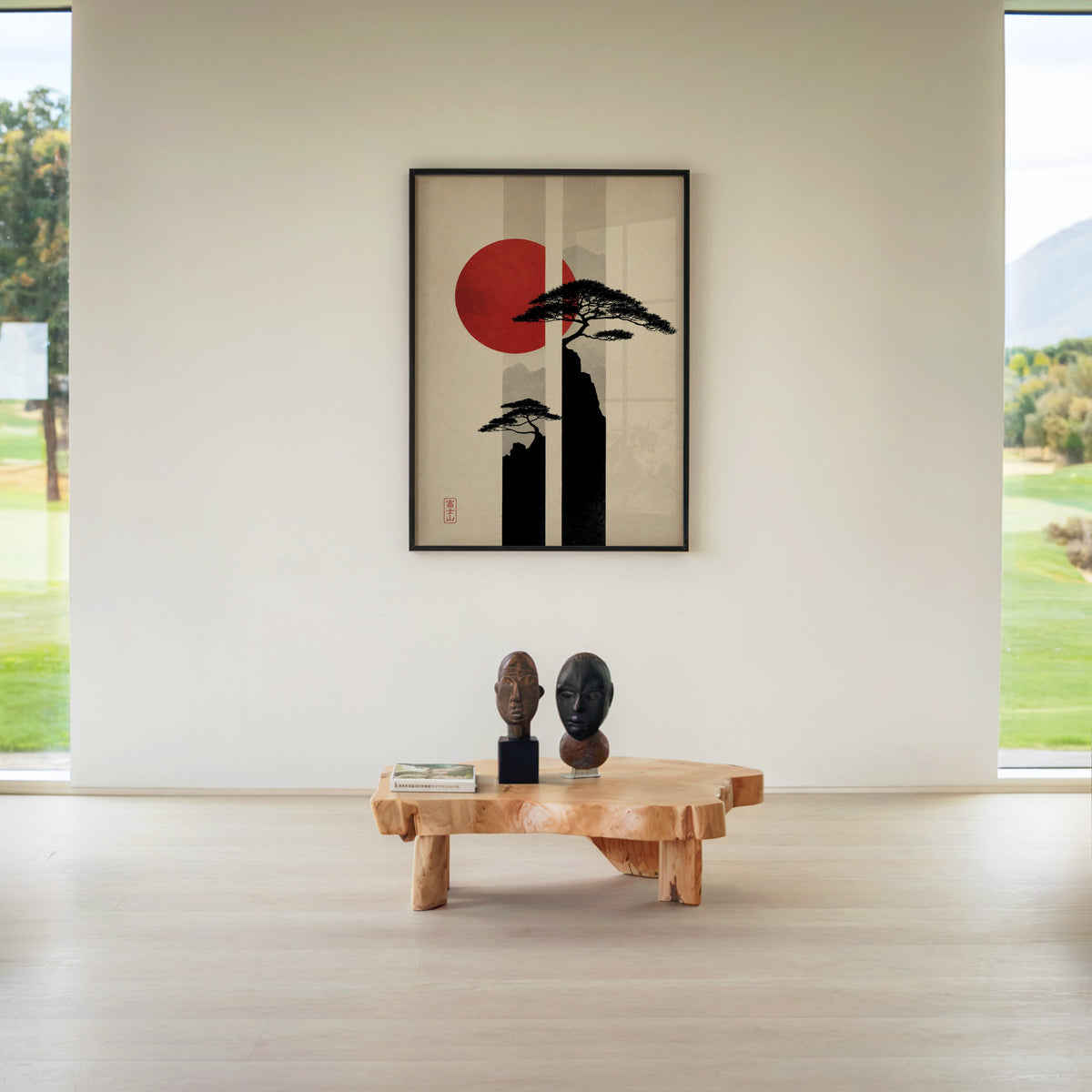 pine cliffs with red sun and stripes print in a black frame above a live-edge wood coffee table between garden windows