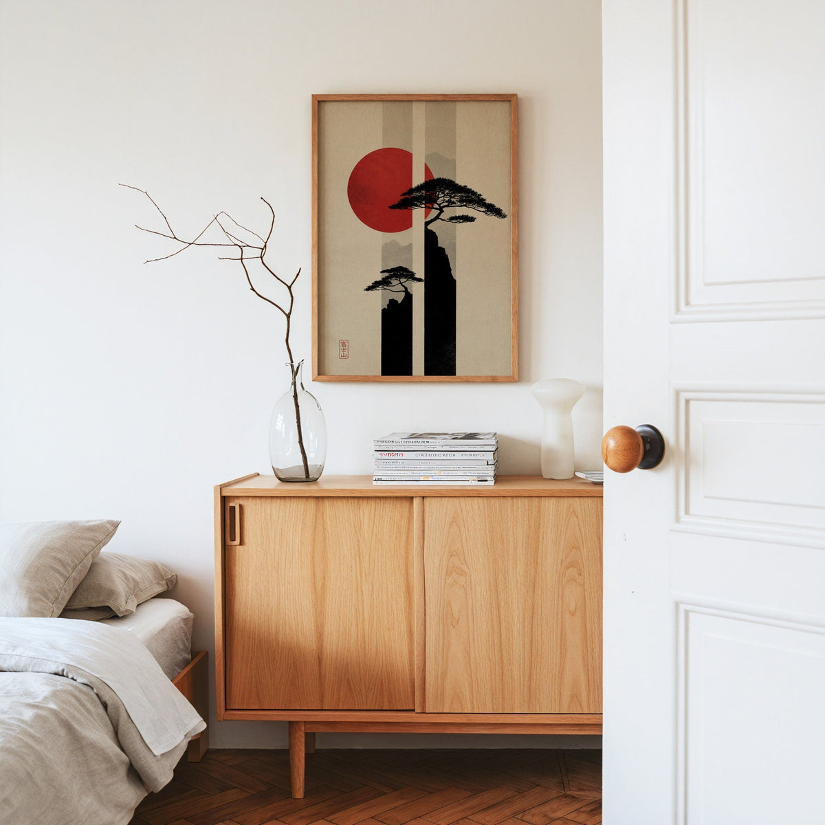 pine cliffs with red sun and stripes print in an oak frame above an oak sideboard in a bedroom with linen bedding