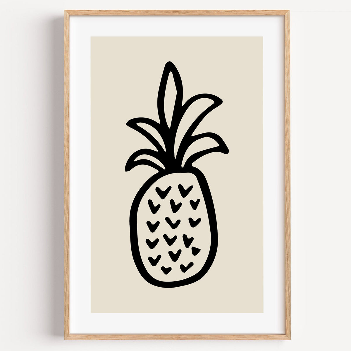 black ink line pineapple beige print in a light oak frame on a plain white wall