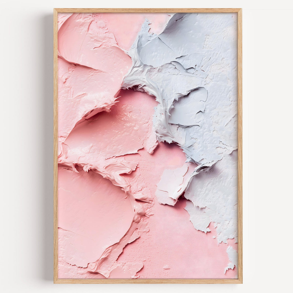 Pink and blue impasto texture pastel print in a light oak frame on a plain white wall