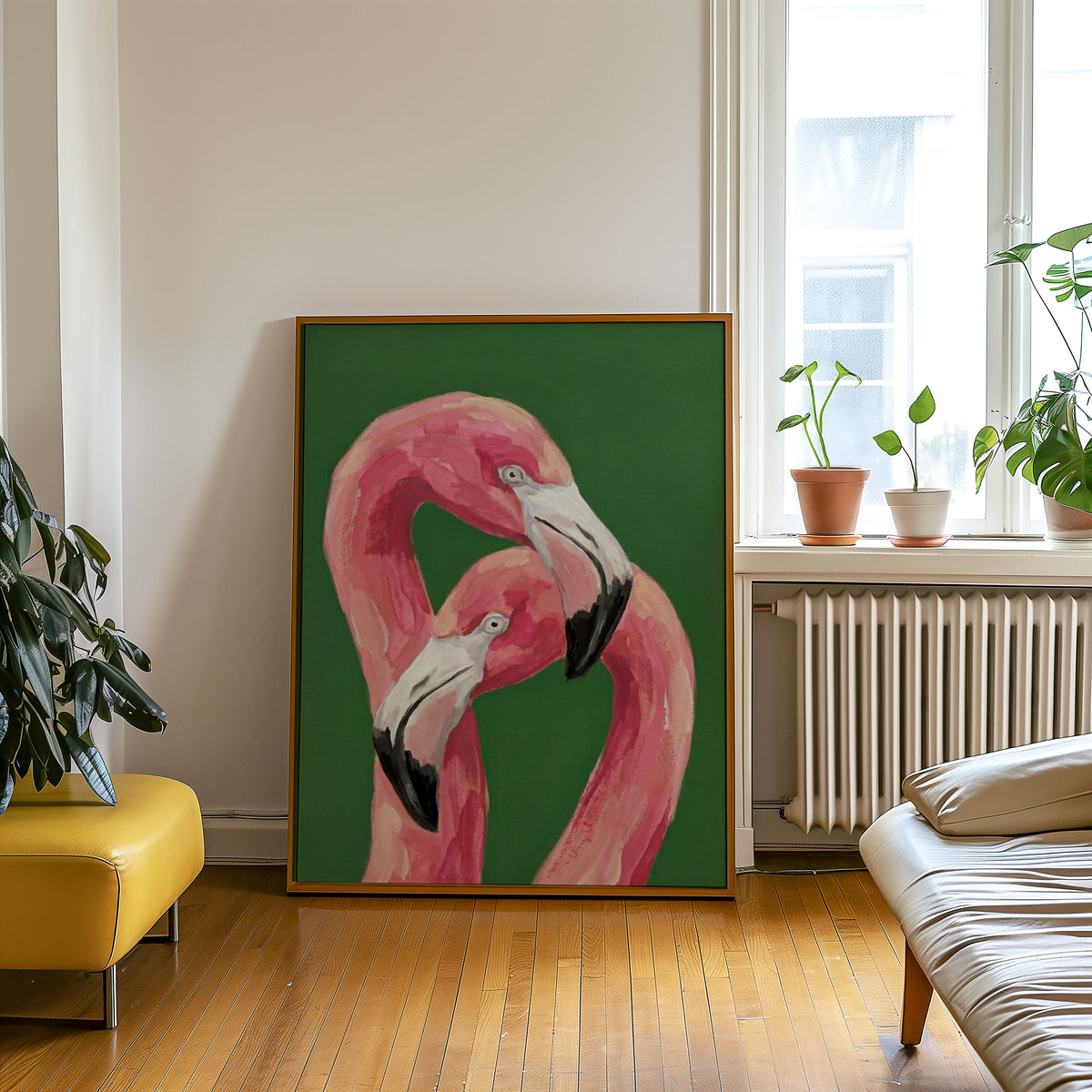 Entwined flamingos print in an oak frame leaning beside a yellow leather bench