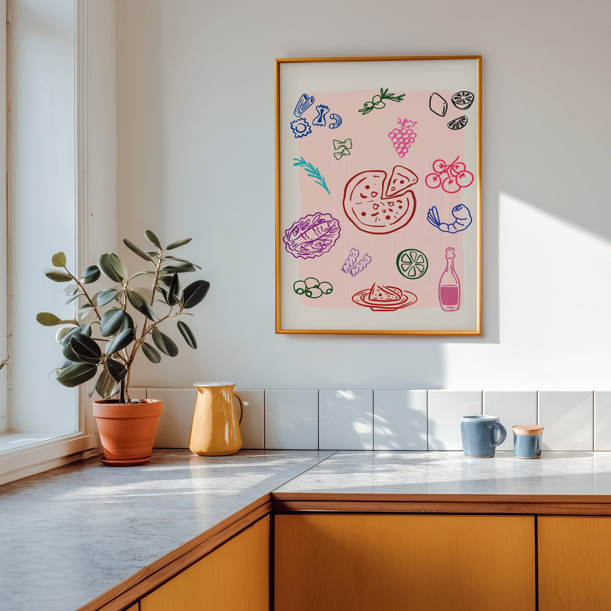 Food doodle print in a gold frame above a marble counter with a yellow ceramic jug