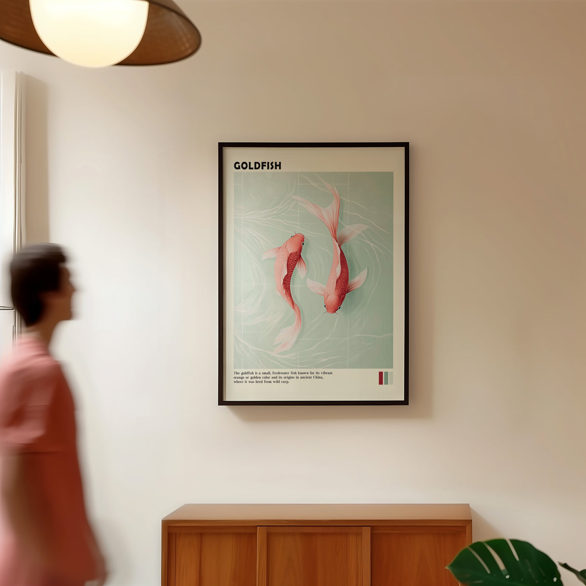 Pink goldfish pair on mint water print in a black frame in a hallway under a rattan pendant