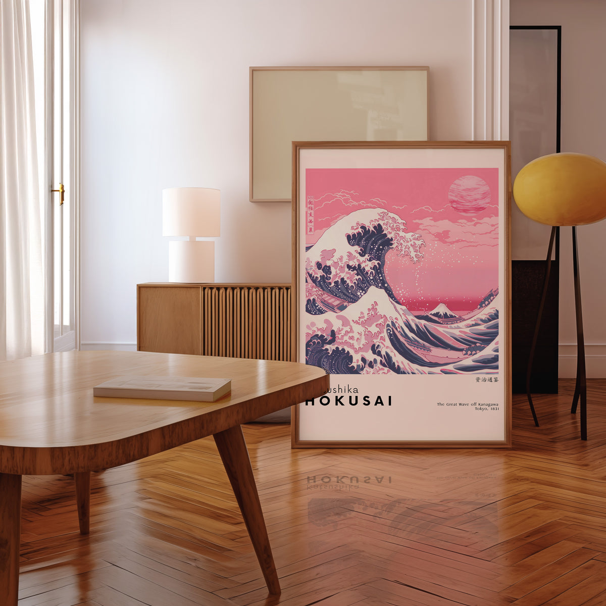 Pink Great Wave off Kanagawa print in a walnut frame leaning in a mid-century living room