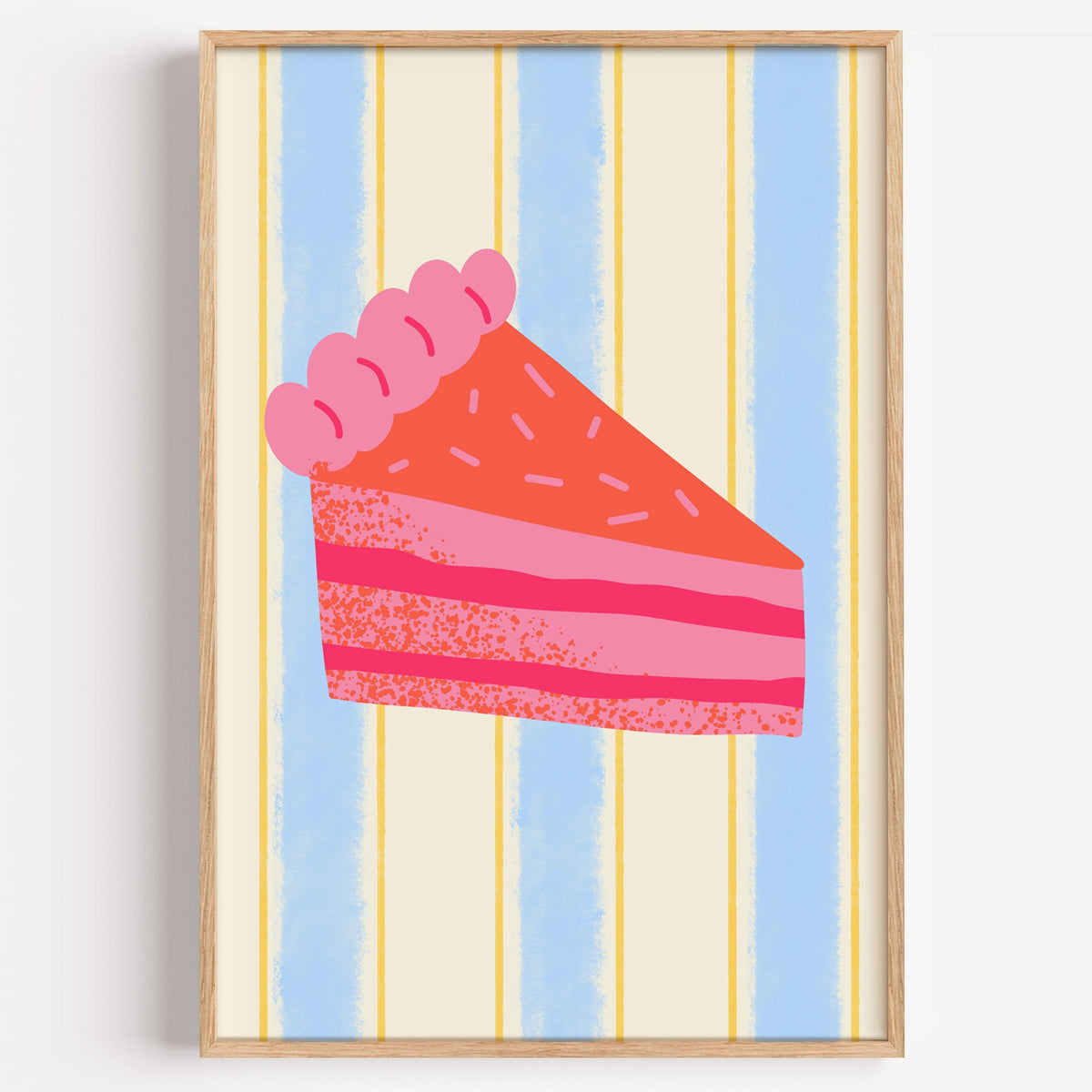 Pink layer cake print in a light oak frame on a plain white wall