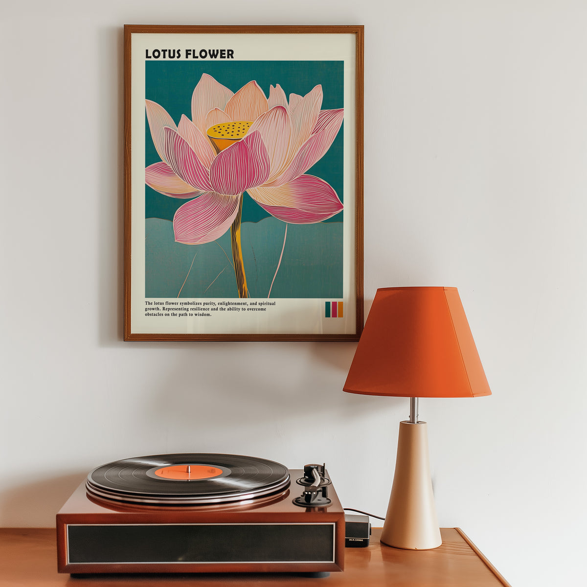 Single pink lotus on teal print in a walnut frame above a sideboard with a record player