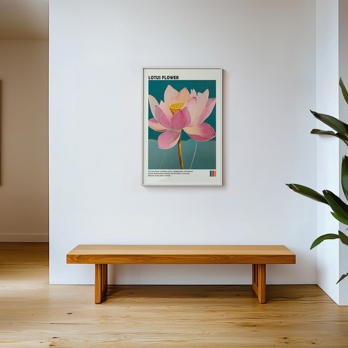 Single pink lotus on teal print shown in a white frame above a wooden entryway bench
